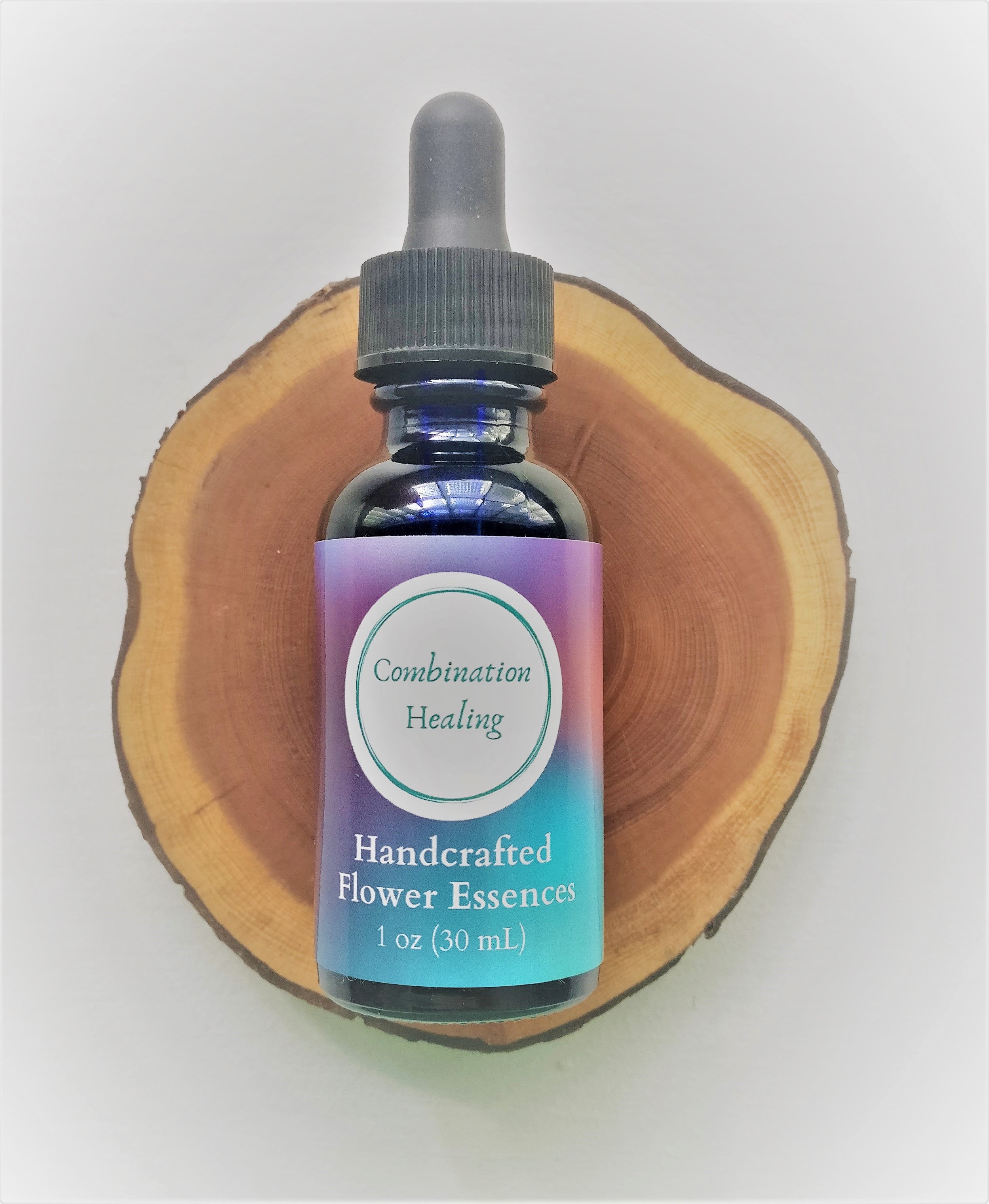 bottle of Combination Healing flower essencs on a round of wood