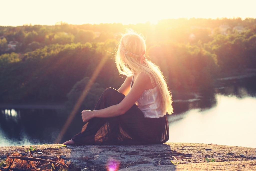 Woman sitting in sunshine