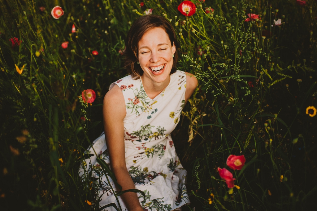 headshot for Lisa Matthews sitting in field of flowers